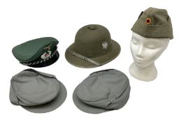 Five reproduction German WW2 hats comprising Wehrmacht olive tropical helmet