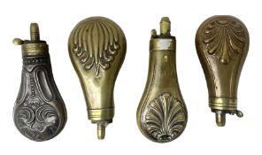 Four small copper/brass pistol powder flasks; two with stylised shell decoration; one with anthemion