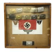 Display of eleven German belt buckles including 'SS'
