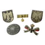 Two WW2 German Army Afrika Korps pith helmet metal side badges; RAD oval metal badge by J.B.u.Co.; W