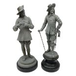 Matched pair of unpainted spelter figures of cavaliers - one standing removing his gloves