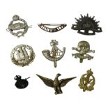 Eight metal military badges comprising Royal Tank Regiment