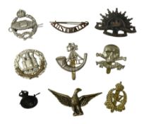 Eight metal military badges comprising Royal Tank Regiment