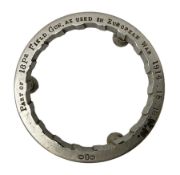 WW1 Trench Art - trivet on three ball feet formed from a section of a gun barrel inscribed 'Part of