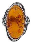 Silver oval Baltic amber ring with leaf design gallery