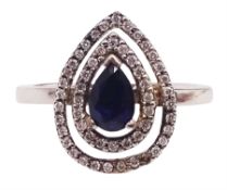 14ct white gold pear shaped sapphire and round brilliant cut diamond cluster ring