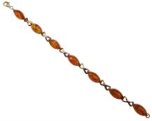 9ct gold oval Baltic amber cross link bracelet