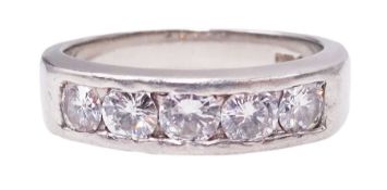 Platinum channel set five stone round brilliant cut diamond ring