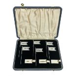 Cased set of six George V Amnora sandwich / canape flags in silver plated frames