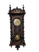 Late 19th cent German wall clock in a mahogany and ebonised case with turned columns and finials