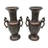 Pair of bronze Japanese vases of baluster form cast with birds amongst blossom and hoho bird handles