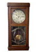 1930s striking wall clock with a spring driven 8-day movement sounding the hours on a gong
