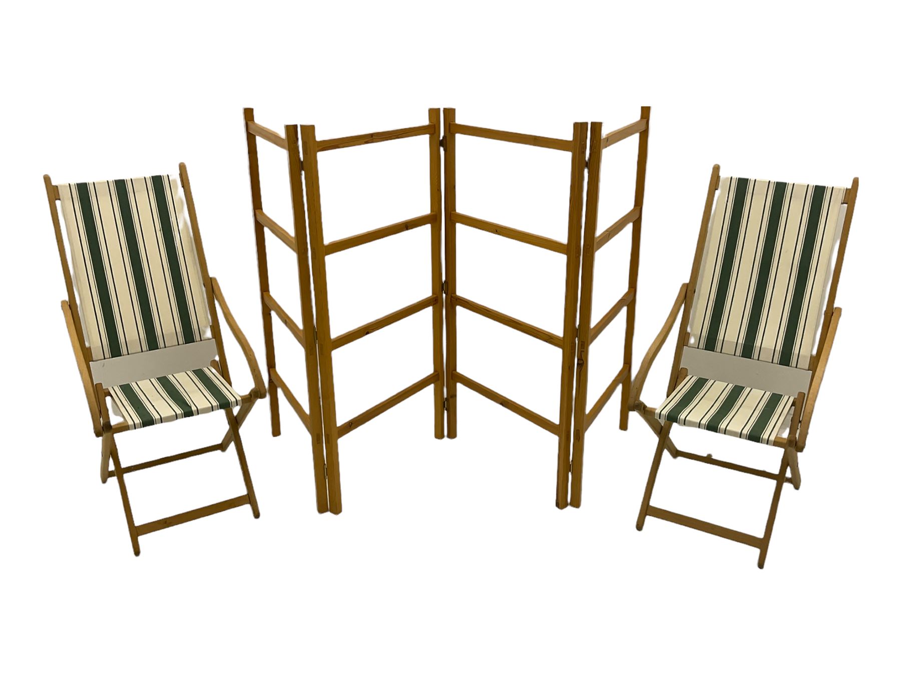 Two folding beech framed garden chairs with slung striped covers and a folding pine clothes horse