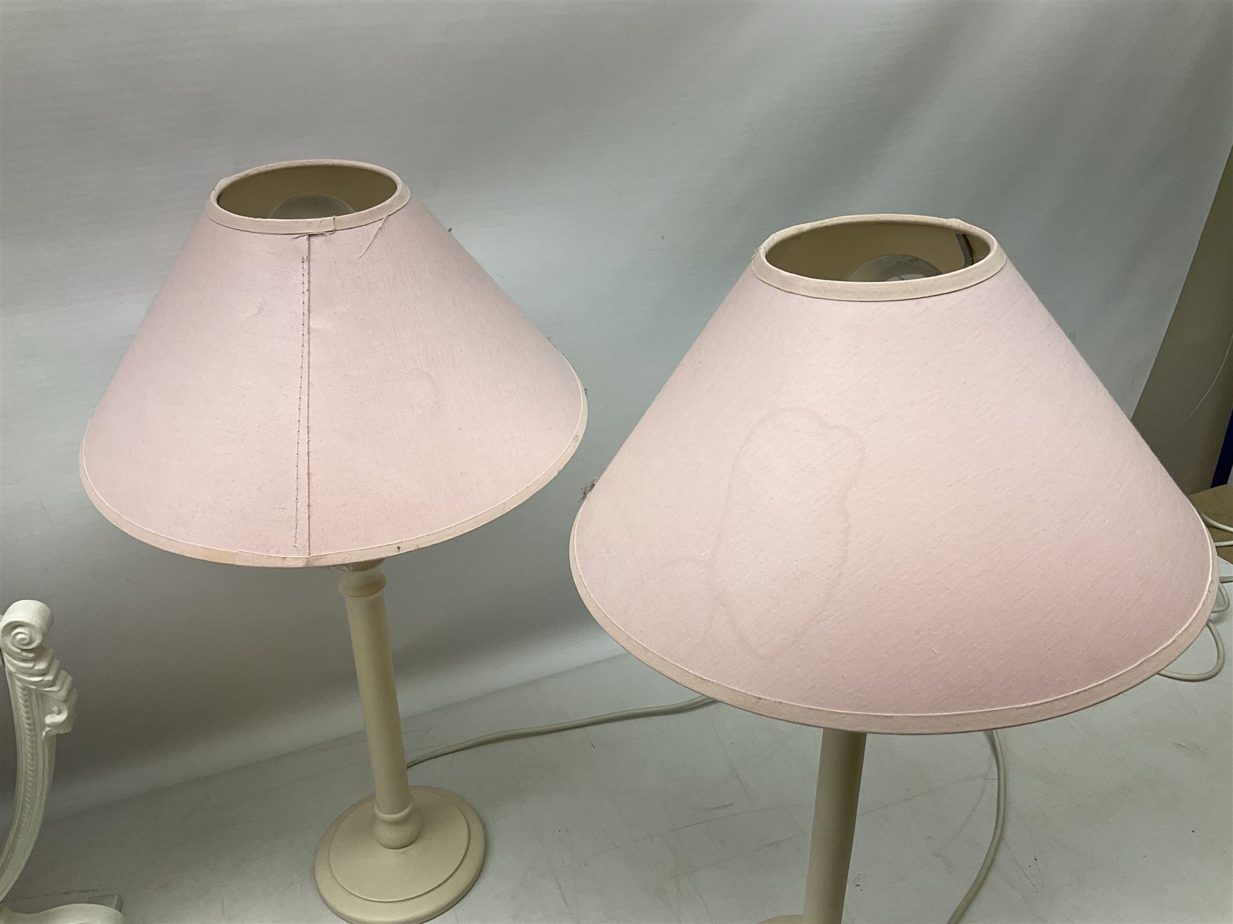 Four white / cream table lamps with pink shades and an ornate mirror of shield form - Image 2 of 9