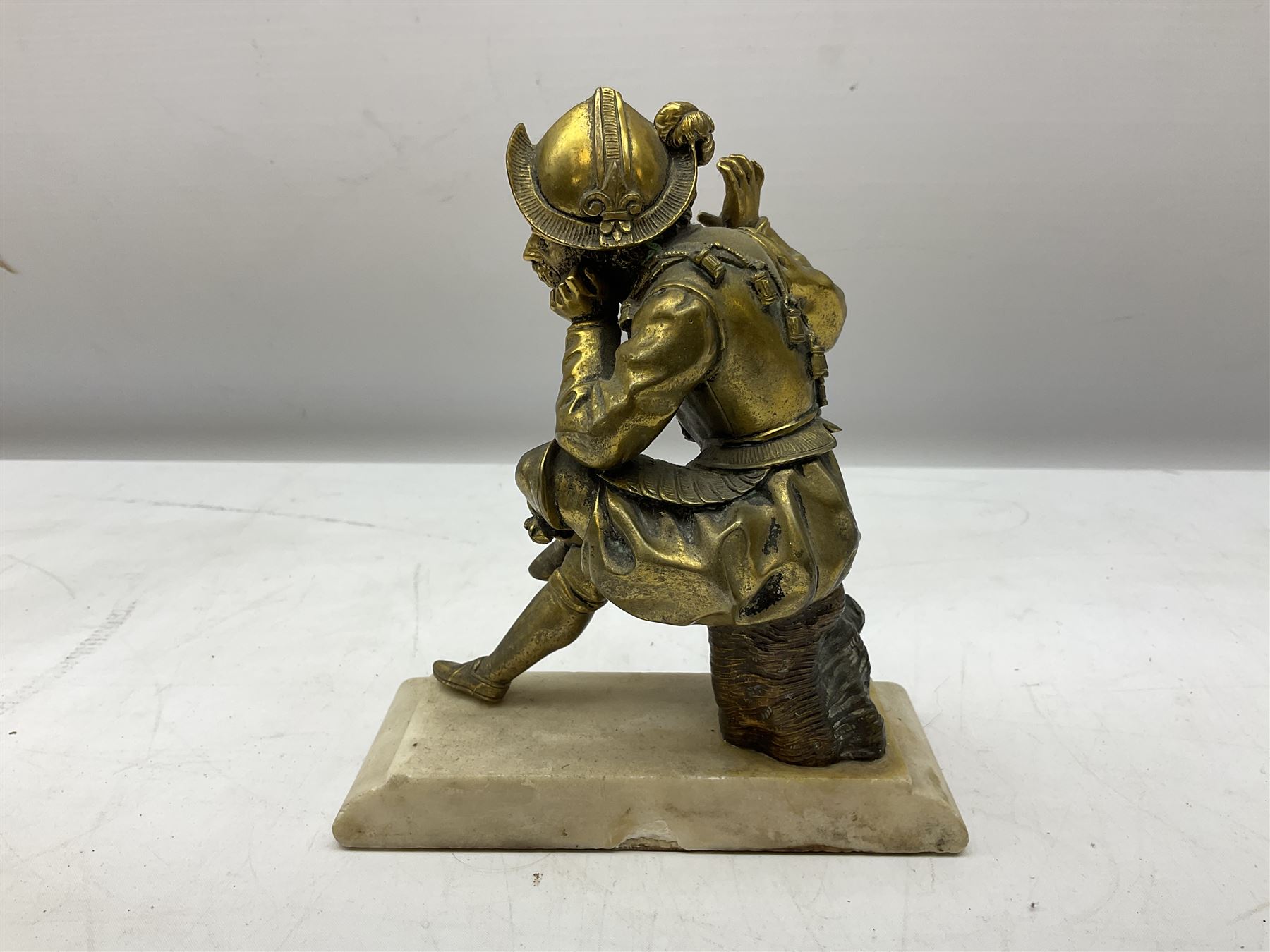 Brass figure of a knight seated up to a tree stump - Image 4 of 4