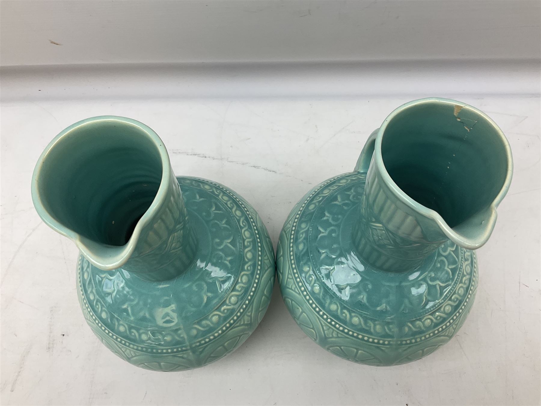 Pair of Lear pottery jugs with a blue ground and floral decoration - Image 3 of 6