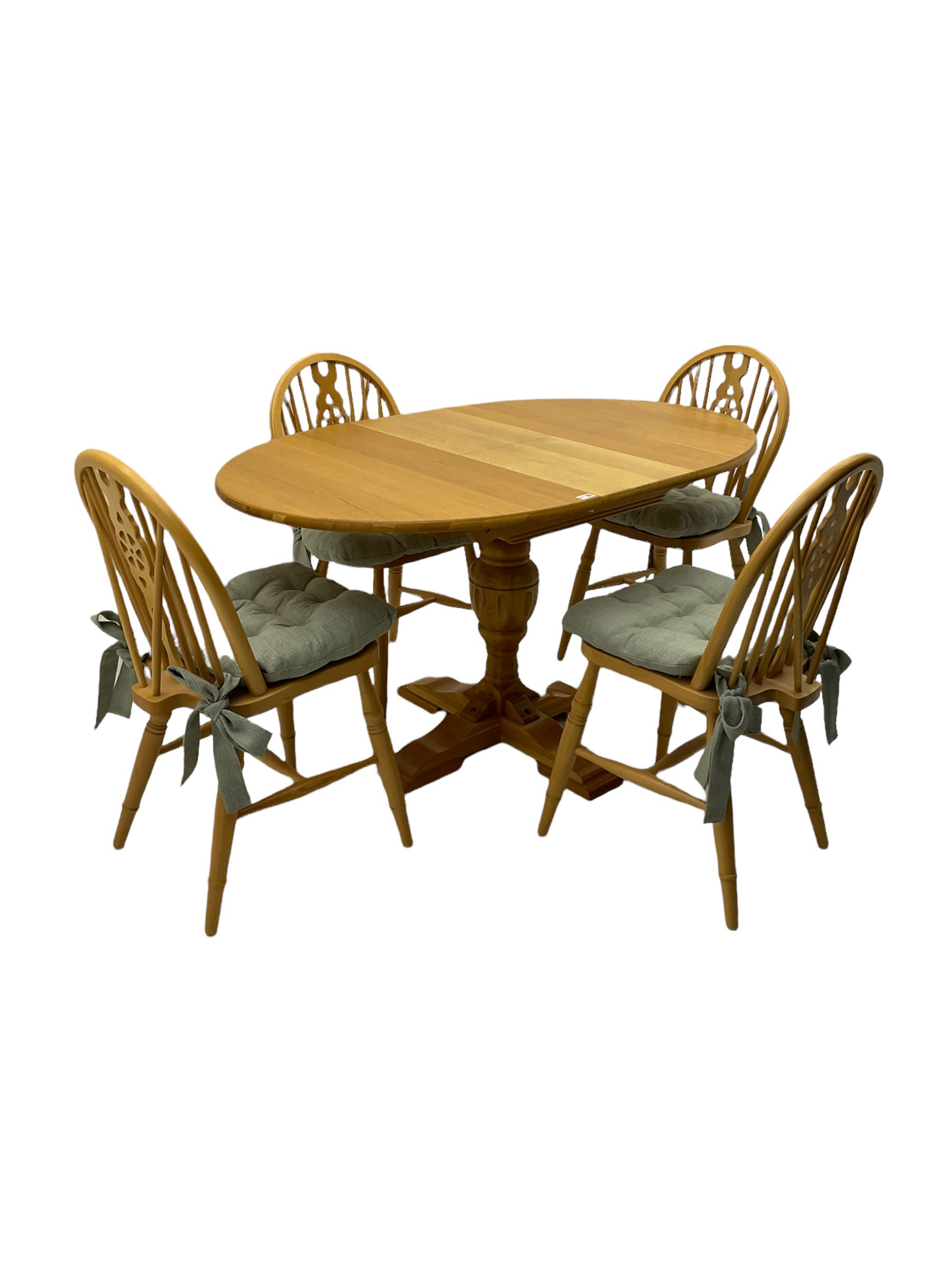 Light oak oval extending dining table