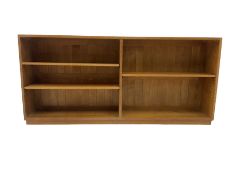 Light oak low two sectional open bookcase fitted with adjustable shelves