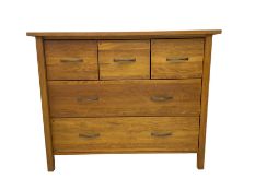 Light oak chest fitted with three small and two large drawers