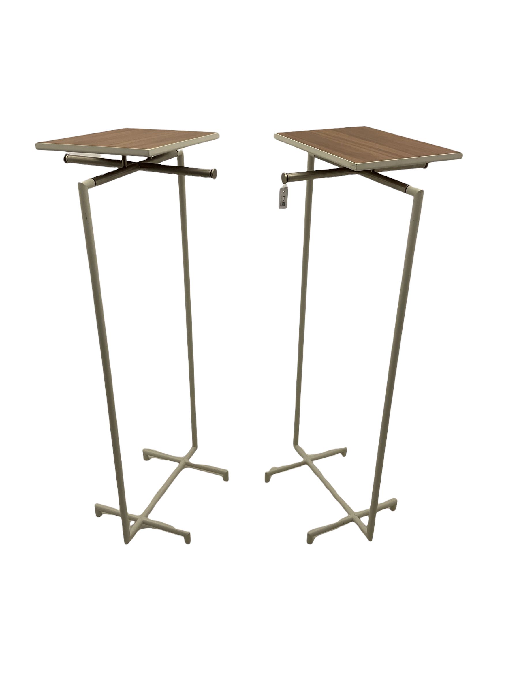 Pair of contemporary shops display clothes rails