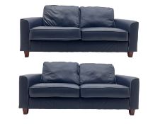 Pair of two seat sofas upholstered in soft blue leather