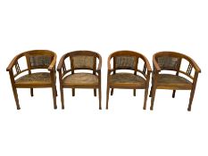 Set of four teak framed tub shaped liner chairs