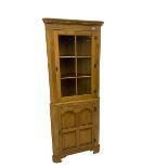 Traditional light oak corner cabinet