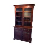 Late Victorian mahogany glazed bookcase on cupboard