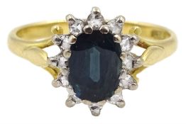 Gold oval sapphire and diamond cluster ring