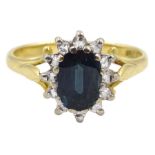 Gold oval sapphire and diamond cluster ring