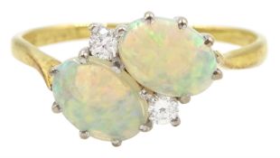 18ct gold two stone oval opal and two stone round brilliant cut diamond crossover ring