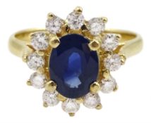 14ct gold oval sapphire and round brilliant cut diamond cluster ring