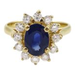 14ct gold oval sapphire and round brilliant cut diamond cluster ring