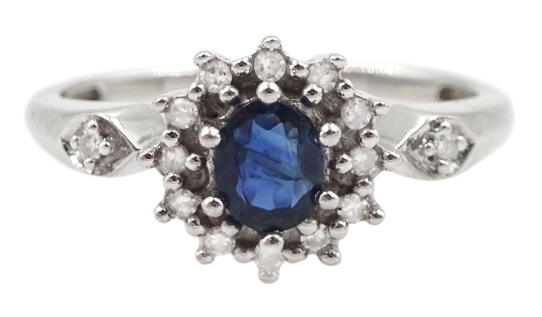 9ct white gold oval sapphire and round brilliant cut diamond cluster ring