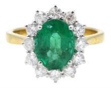 18ct gold oval emerald and round brilliant cut diamond cluster ring