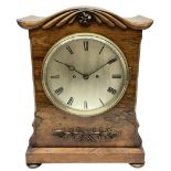 A William IV c1820 twin fusee bracket clock in a rosewood case with a crested top and applied carvin