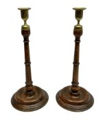 Pair of George III style oak candlesticks