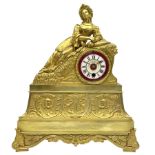 A Napoleon III c1860 French Ormolu mantle clock with a reclining figure of an oriental lady on a ste