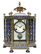 A decorative 20th century Chinese mantle clock with blue cloisonn� decoration and four bevelled gla