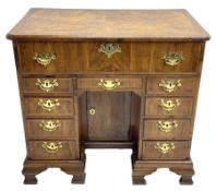 Early 18th century Queen Anne figured walnut kneehole desk with secretaire drawer