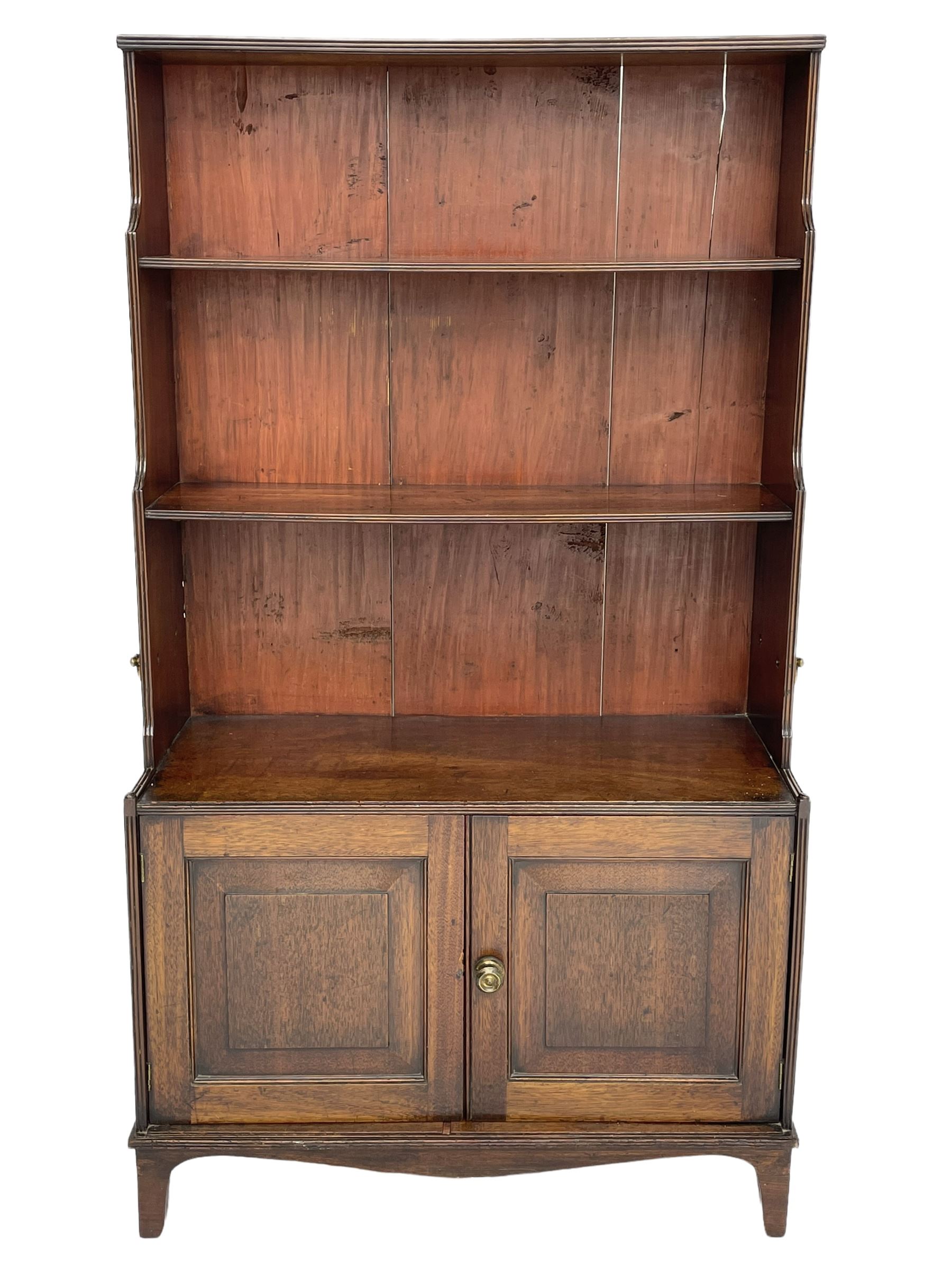 George III mahogany waterfall bookcase on cupboard