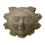 Carved pine mask of the sun