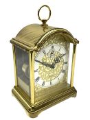 A 20th century brass cased Kieninger (German) chiming mantle clock with a break arch top and three g
