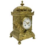A French twin train striking mantle clock c1890 in a brass case with a decorative plinth raised on f