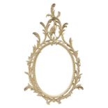 Oval wall mirror in carved and limed beech frame