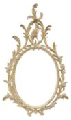 Oval wall mirror in carved and limed beech frame