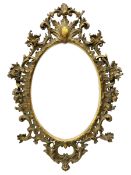 Large 19th century Florentine style oval mirror in carved giltwood and gesso frame