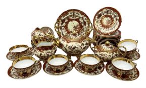 20th century German part tea service decorated in an oriental design with gilt detail