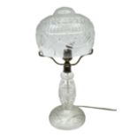 Waterford style cut crystal table lamp with mushroom shade and shaped central column upon a circular