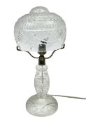 Waterford style cut crystal table lamp with mushroom shade and shaped central column upon a circular